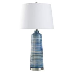 a blue lamp with a white shade on it