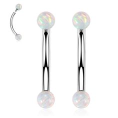 two pairs of surgical piercings with white opal balls on each end and an attached bar