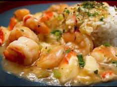 some shrimp and rice on a plate with broccoli