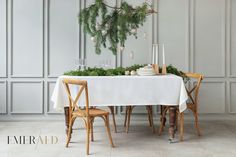 a table with two chairs and a white table cloth