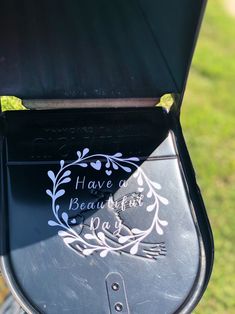 a close up of an open grill on the grass