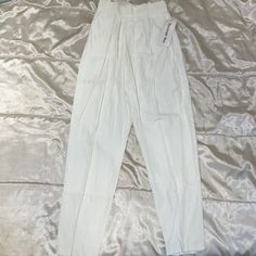 White Size Small Measurements Flat: Waist 11”, Hip 16”, Rise 13”, Inseam 29” Vintage, High Waisted, Office Siren Trousers, Pleated, Summer High-waist White Pants With Belt Loops, High Waist White Pants With Belt Loops, White Fitted Tapered Leg Pants, Fitted White Tapered Leg Pants, White Tapered Leg Bottoms For Spring, White High Waist Pants With Elastic Waistband, Spring White Tapered Leg Bottoms, White Fitted High-rise Pants, White Stretch Bottoms With Tapered Leg