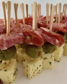 small appetizers with toothpicks and cheese on them