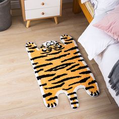 a tiger rug on the floor in a bedroom