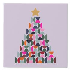 a colorful christmas tree with stars on top