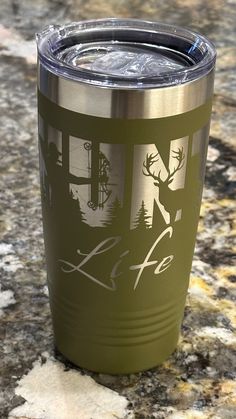 a stainless steel tumbler sitting on top of a granite counter