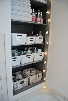 the bathroom is organized and ready to be used as a storage area for personal care items