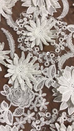 white lace with flowers on a brown background