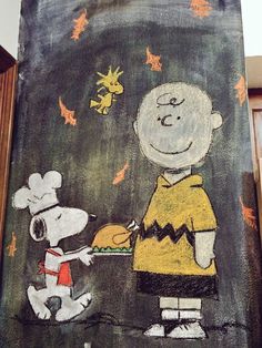 a chalk drawing of a cartoon character handing food to a little boy in front of him