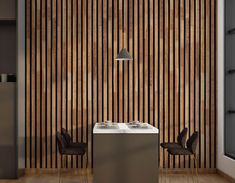 an empty table and chairs in front of a wall with vertical wood slats on it