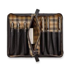 Take pens or small tools with you in this zip-secure case with built-in pouch, crafted in our pebbled, full-grain mocha leather with plaid twill lining. The attached zippered accessories pouch can hold ink refills, erasers or other small items. It holds up to seven instruments of varying sizes, each in their own sleeve.