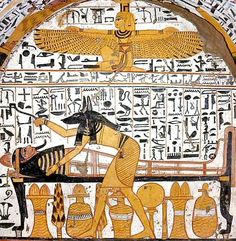 an ancient painting with egyptian writing and paintings on the wall, including two men sitting at a table