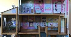 a doll house is shown with all the furniture and accessories in it's display case