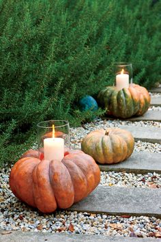 an instagram page with pumpkins and candles on the ground in front of them