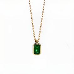 14k Yellow Gold Radiant shape Emerald (may birthstone) Gold Bezel Setting Pendant Necklaces. Main Stone: Radiant Shape Natural Emerald In Weight Of 0.45 Ct Color - Green Chain length 45cm (17.7inch) with a stop at 42cm (16.5inch) for shorter option Alena Diamonds & Jewelry was created from our passion for custom-made jewelry, and for fulfilling our customer's fantasies. We are Alex and Maayan, we created Alena after years of experience we received by working in the jewelry industry, Starting from diamond gemology in the Israeli diamond exchange, and then making fine crafted gold jewelry with our beautiful diamonds that we choose one by one very carefully and by our long experience of diamond gemology. Alex is a certified Diamond gemologist by C.G.S gemology known school in the diamond exch May Birthstone Pendant Necklace With Bezel Setting, Classic Green Jewelry With Smooth Bezel, Green Pendant Necklace With Bezel Setting, Yellow Gold Necklace With Emerald Cut Bezel Setting, Yellow Gold Emerald-cut Necklace With Bezel Setting, Yellow Gold Emerald Cut Necklace With Bezel Setting, Classic Emerald Necklaces With Bezel Setting, Classic Emerald Pendant Necklace In Bezel Setting, Classic Emerald Pendant Necklace With Bezel Setting