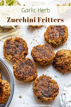 four zucchini fritters on top of a table