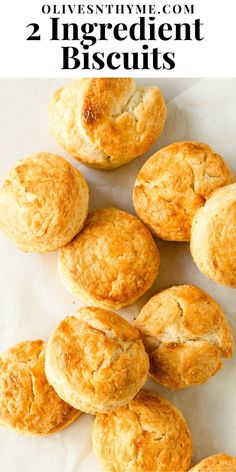 some biscuits that are sitting on top of white paper with the words, two ingredient biscuits