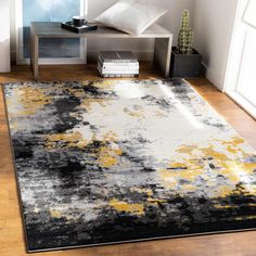 an area rug with yellow and gray colors