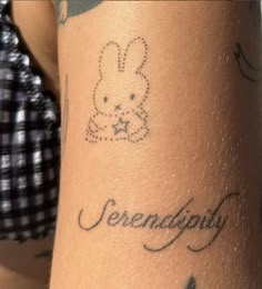 a woman's arm with tattoos on it and the words serendigo written in cursive writing