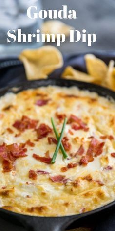 a close up of a pizza in a pan with bacon and cheese on the top