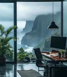 an office with a view of the ocean and cliffs in the distance is featured on this wall - to - wall glass window