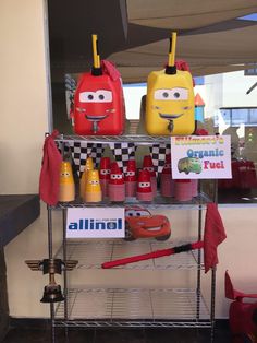 some food items on a metal shelf with signs