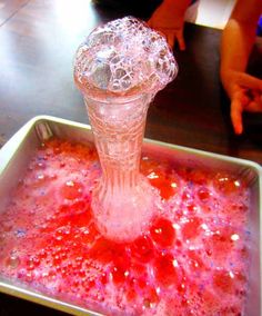 a pink substance in a square bowl on a table