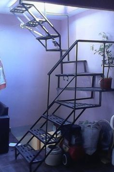 a man standing next to a set of stairs