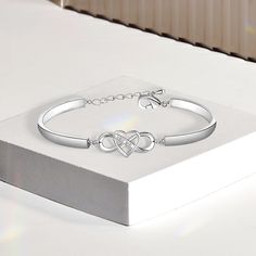 If you're looking for a beautiful and meaningful way to show the eternal love you have for your daughter, this bracelet is a perfect choice. The bracelet is intricately designed with a sparkling infinity heart charm, representing the never-ending love between a mother and her daughter. Whether she's heading off to college, getting married, or starting a family of her own, she is sure to cherish this heartfelt gift for years to come. WHY BUY FROM US?: Crafted in Solid Surgical Stainless Steel and Keep Me In Your Heart, Starting A Family, To My Granddaughter, Dulhan Mehndi, Dulhan Mehndi Designs, Infinity Heart, Charm Making, Experience Gifts, Everlasting Love