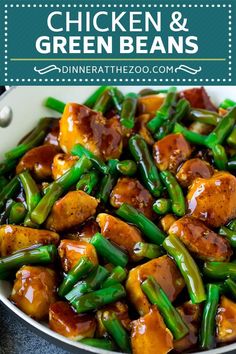 a pan filled with green beans and tofu in sauce on top of a table