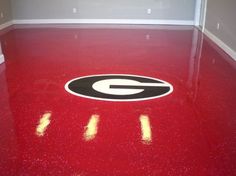 a red floor with the letter g painted on it