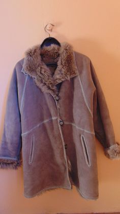 "Vintage women's suede, shearling jacket, gray leather coat, warm winter jacket, fur coat shearl jacket, winter leather coat Excellent quality jacket, in a lovely gray with sheepskin shearling lining. Single breasted jacket with buttons, large sheepskin collar and two side pockets. The coat is special leather cleaning threated In good condition, Fur coat had gone to the cleaners No label size , but please check measurements. Measurements: Underarm to underarm 20,86\" / 53cm Shoulder to hem 31.49 Vintage Sheepskin Leather Jacket For Fall, Vintage Leather Jacket With Faux Fur Lining For Winter, Vintage Sheepskin Fur Coat For Cold Weather, Luxury Vintage Shearling Fur Coat, Vintage Brown Sheepskin Outerwear, Warm Winter Jackets, Single Breasted Jacket, Shearling Jacket, Grey Leather