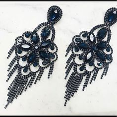 “Drop-Dead” Gorgeous Large Statement Earrings! If You Are Someone Who Loves True Chandelier Style Earrings, Then This 6” Long Shoulder Duster Is A Knock Out. Large Swarovski Crystals In Montana Blue (Navy) Are Bordered By Jet Black To Create This Wonderful Attention Getting, Elegant Combo. 6” L X 3” W Swarovski Crystals Surgical Steel Posts Glamorous Blue Chandelier Earrings For Party, Glamorous Blue Chandelier Drop Earrings, Glamorous Blue Chandelier Earrings, Blue Chandelier Drop Earrings For Evening, Elegant Blue Chandelier Earrings For Party, Glamorous Blue Earrings For Party, Large Statement Earrings, Crystal Chandeliers, Chandelier Style