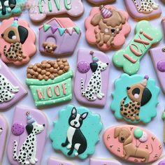 some decorated cookies are laying on a table