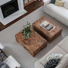 an aerial view of a living room with two couches and a coffee table in the middle