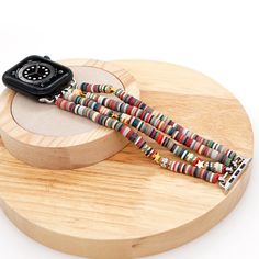 Unique Heishi-style, beautiful stretchy boho bracelet band. Handcrafted using stackable high-quality natural stones, consisting of different materials, shapes, and colors. Compatible with all Apple Watch models, including the latest Series 10 and Ultra 2. Works seamlessly across Series 1-10, SE, Ultra, Sport, and Edition. Available for every size: 38mm, 40mm, 41mm, 42mm, 44mm, 45mm, 46mm, and 49mm. Ideal for any Apple Watch user looking for a perfect fit. Fits wrist sizes 5.0" - 8.1". Lightweigh Hand-strung Bohemian Heishi Beads Bracelets, Black Bead Apple Watch Band, Custom Black Apple Watch Band With Bracelet Strap, Spiritual Hand-strung Heishi Beads, Casual Hand-strung Heishi Beads, Heishi Bracelet, Watch Band Bracelet, Elastic Rope, Latest Series