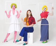 three women dressed as clowns are posing for the camera