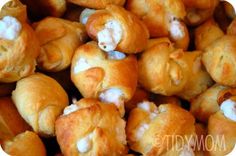 a pile of breaded pastries sitting on top of each other in a bowl