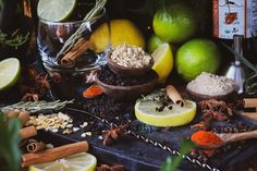 an assortment of spices, herbs and lemons