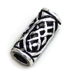 a silver bead with an intricate design on it