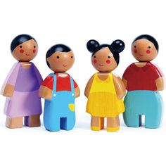 three wooden dolls standing next to each other