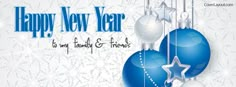 a happy new year greeting card with blue and white balls, stars and snowflakes