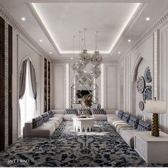 an elegant living room with chandelier, couches and tables