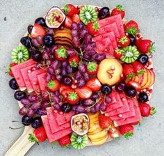 a platter filled with lots of different types of fruit