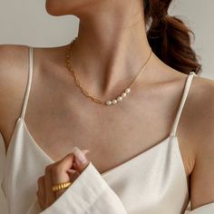 "A feminine and Parisian-styled necklace, designed with a mix of a paperclip chain and a set of organic freshwater pearls. You may place the pearls at different positions (in the center or side) to align with your outfit. Do it like a Parisienne that you will fall in love with it - Materials: 18K gold plated titanium and organic freshwater pearls - Measurements: the width of the paperclip chain is about 0.15\" / 4mm - Length: approximately 16.5\" / 42cm in total length with 2\" / 5cm extension - Pearl Necklace With Paperclip Chain, Paperclip Chain Necklace, Feminine Jewelry, Pearls Necklace, Freshwater Pearl Necklaces, Paper Clip, Parisian Style, Fresh Water, Freshwater Pearls