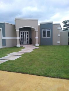 a house that has grass in front of it