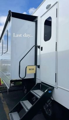 a white trailer with the words last day written on it's door and stairs