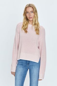 Medium weight, waffle knit sweater. Raglan, long sleeves with monochromatic rib trim at neckline, sleeves, and hem. Designed with an elongated crop proportion and split hem that grazes the waistband. 100% Cotton Imported Pink Cropped Sweater With Ribbed Cuffs For Spring, Pink Knit Sweater With Ribbed Neckline, Pink Ribbed Sweater For Layering, Pink Cropped Crew Neck Sweater With Ribbed Cuffs, Pink Crew Neck Cropped Sweater With Ribbed Cuffs, Pink Relaxed Fit Sweater For Layering, Pink Sweater With Ribbed Neckline For Fall, Pink Ribbed Neckline Sweater For Fall, Cotton Cropped Sweater With Ribbed Cuffs For Layering