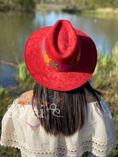 This Mexican Suede Sombrero has beautiful hand painted flowers, perfect to add that special touch to any outfit. Bohemian Red Brimmed Sun Hat, Bohemian Red Wide Brim Sun Hat, Traditional Red Summer Hat, Red Curved Brim Felt Hat For Festivals, Artisan Red Festival Hat, Artisan Red Hats For Festival, Artisan Red Hat For Festivals, Red Felt Hat With Curved Brim For Festivals, Bohemian Red Fedora With Flat Brim