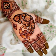 henna tattoo on the palm of a woman's hand